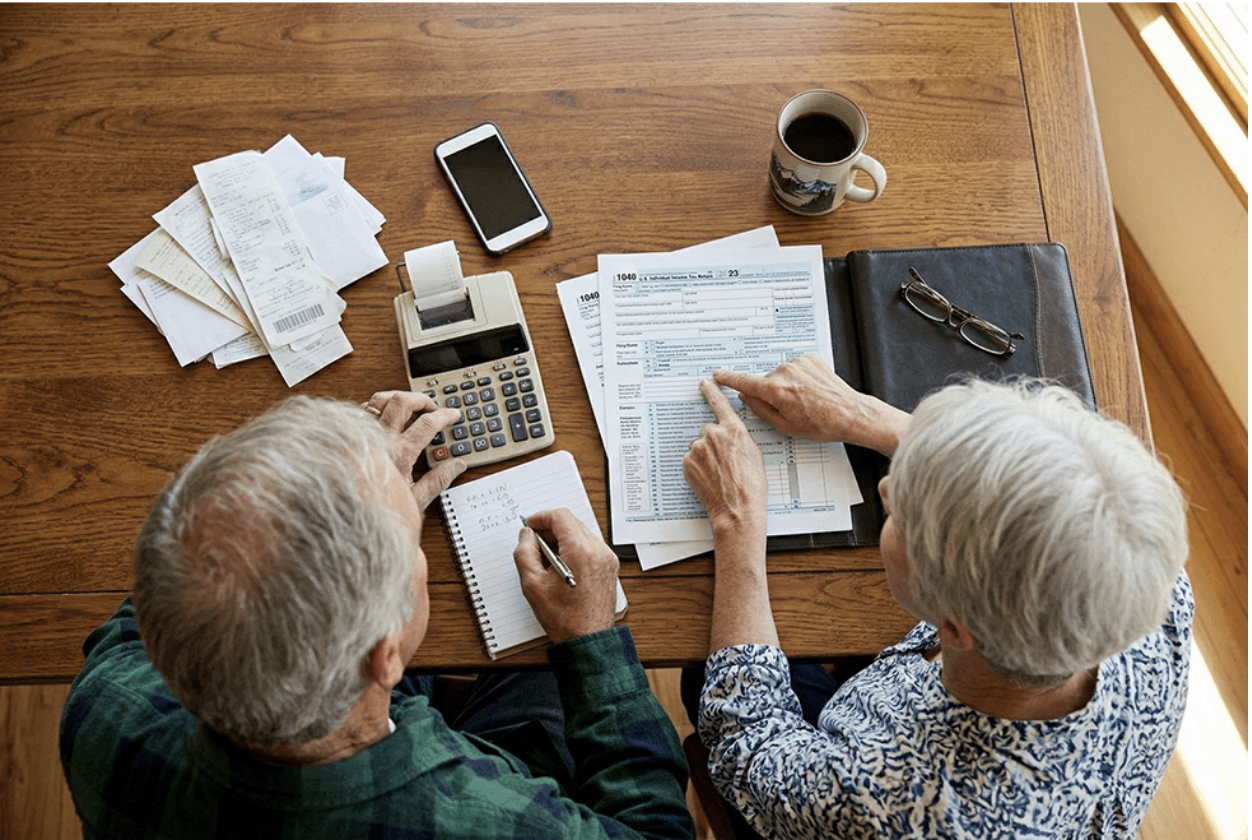 A senior couple reviewing the Medicare tax deductions availabe to them.