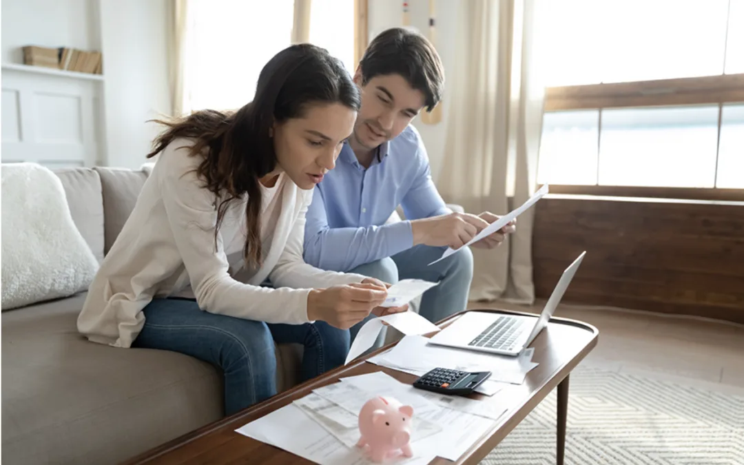 young couple looking at health insurance options for next year.