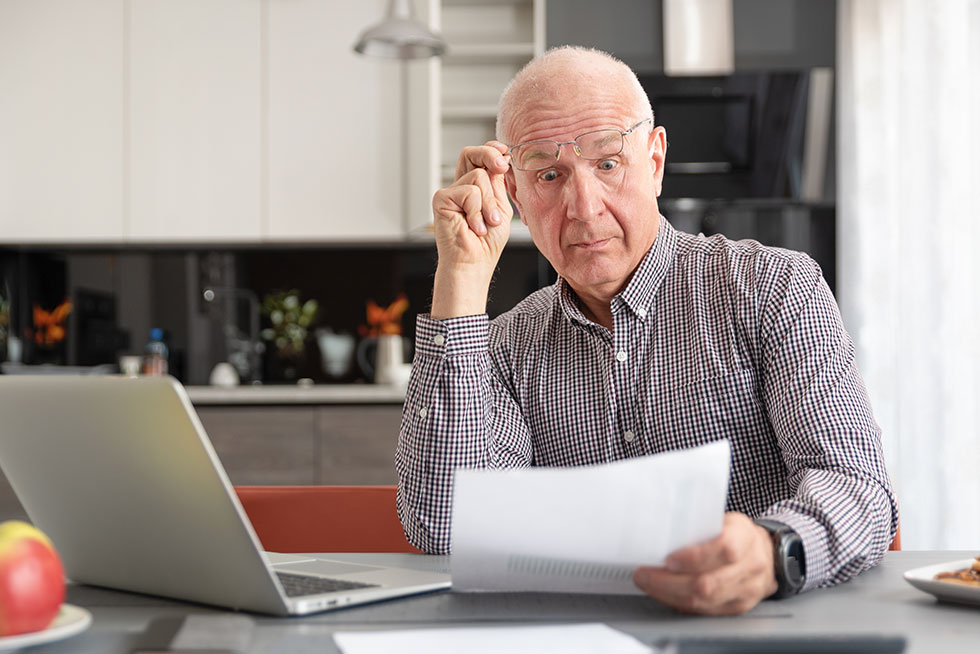 Senior man worried about his Medicare prescription bills.